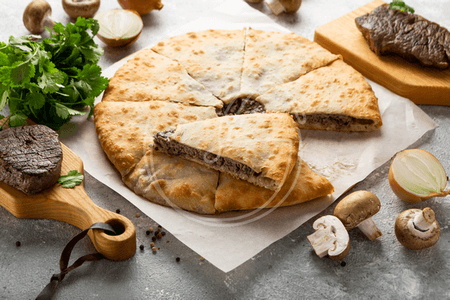 Пиріг-хінкалі із телятиною з грибами і ноткою кінзи